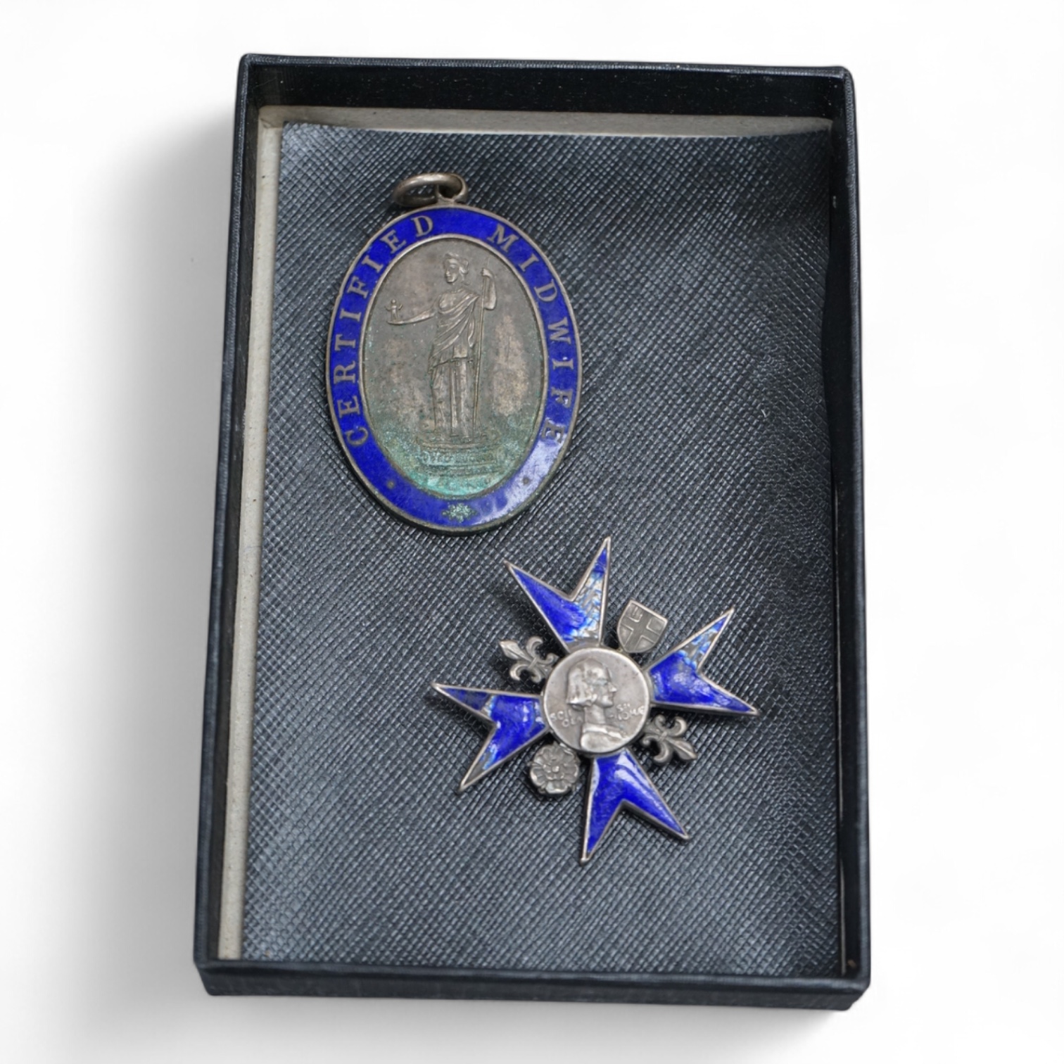 A Nightingale School enamelled ‘Loyalty’ badge, engraved to Audrey Slade, 1948 and a Certified Midwife medallion